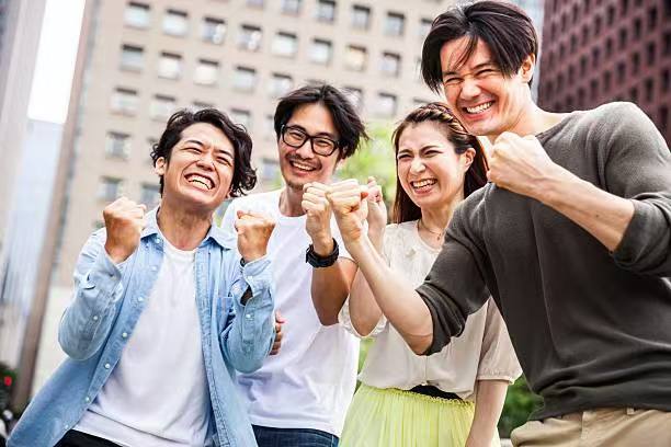 Hand holding phone with social media likes and hearts