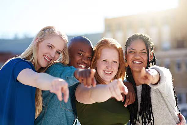Group of people holding smartphones together